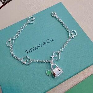 Tiffany & Co. Silver Bracelet with Heart and Handbag Charms